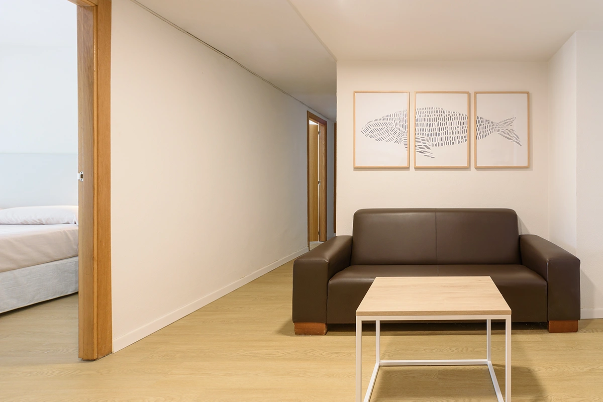 Living area with sofa Living area with sofa and coffee table in the Family Room Fergus Club Palmanova Park Hotel