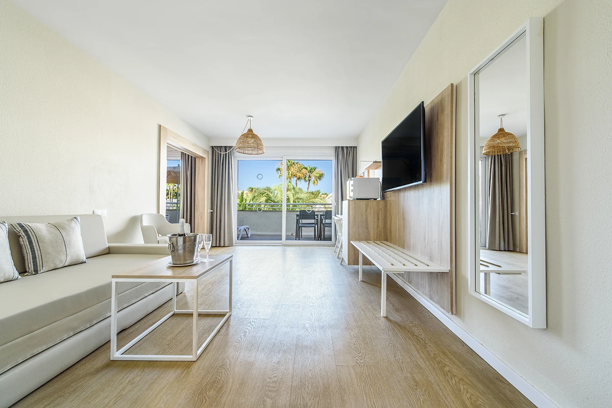 Spacious living area Spacious living area with sofa and television Premium Suite Fergus Club Palmanova Park Hotel